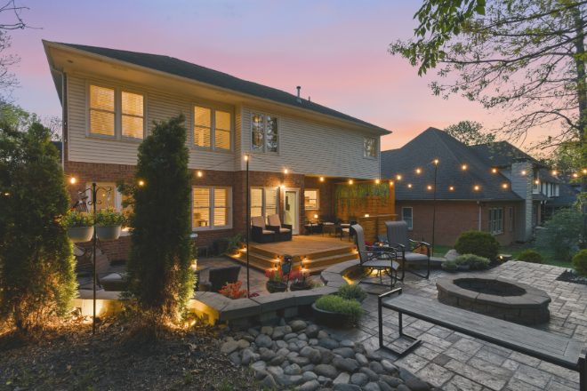 Backyard patio at twilight in a Jessica King listing